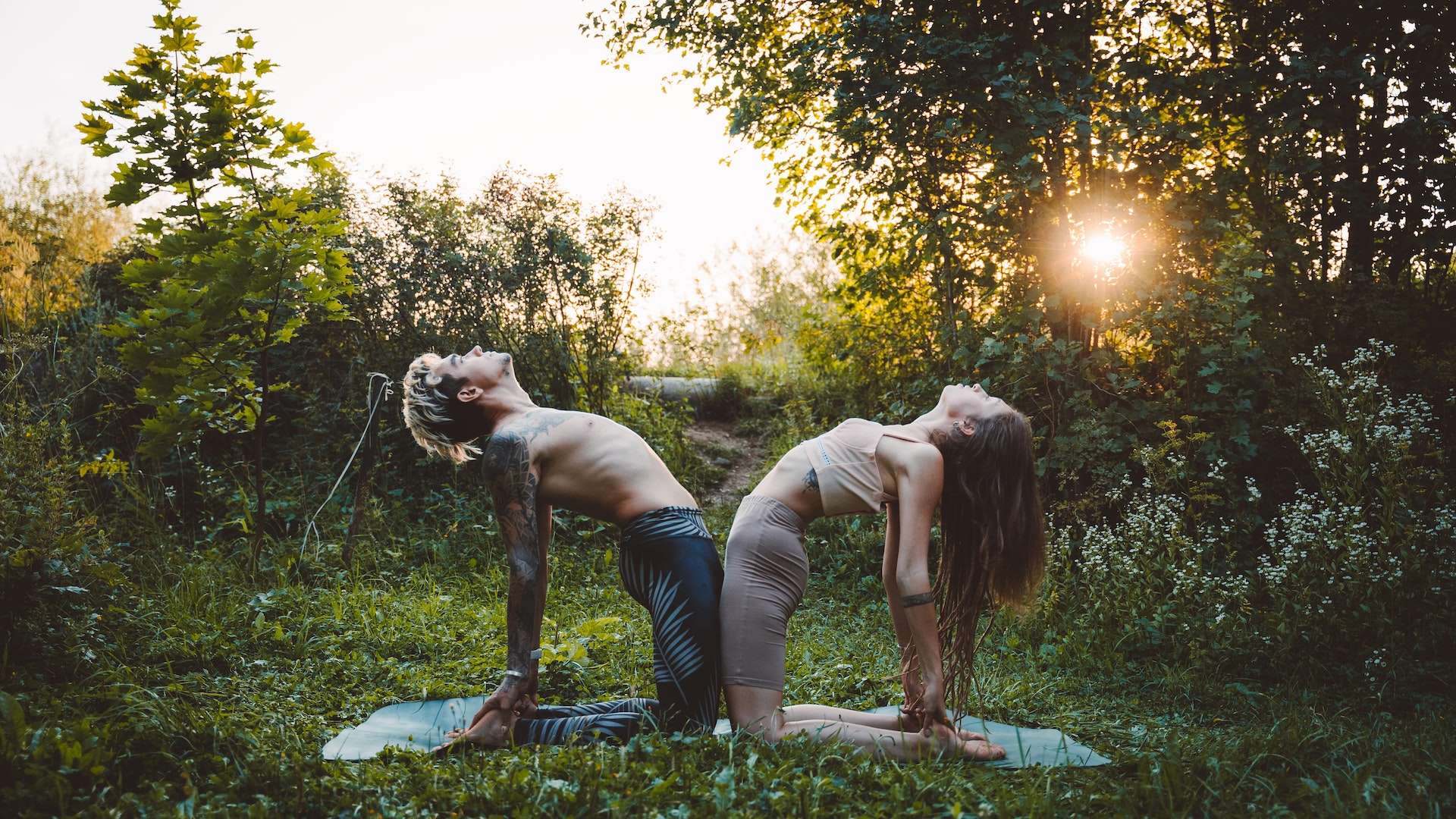 A Couple Doing a Yoga Pose 