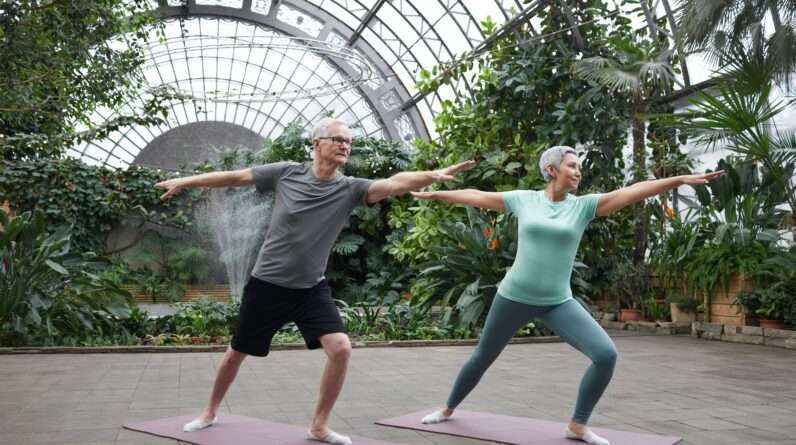 Couple Practicing Yoga for weight loss