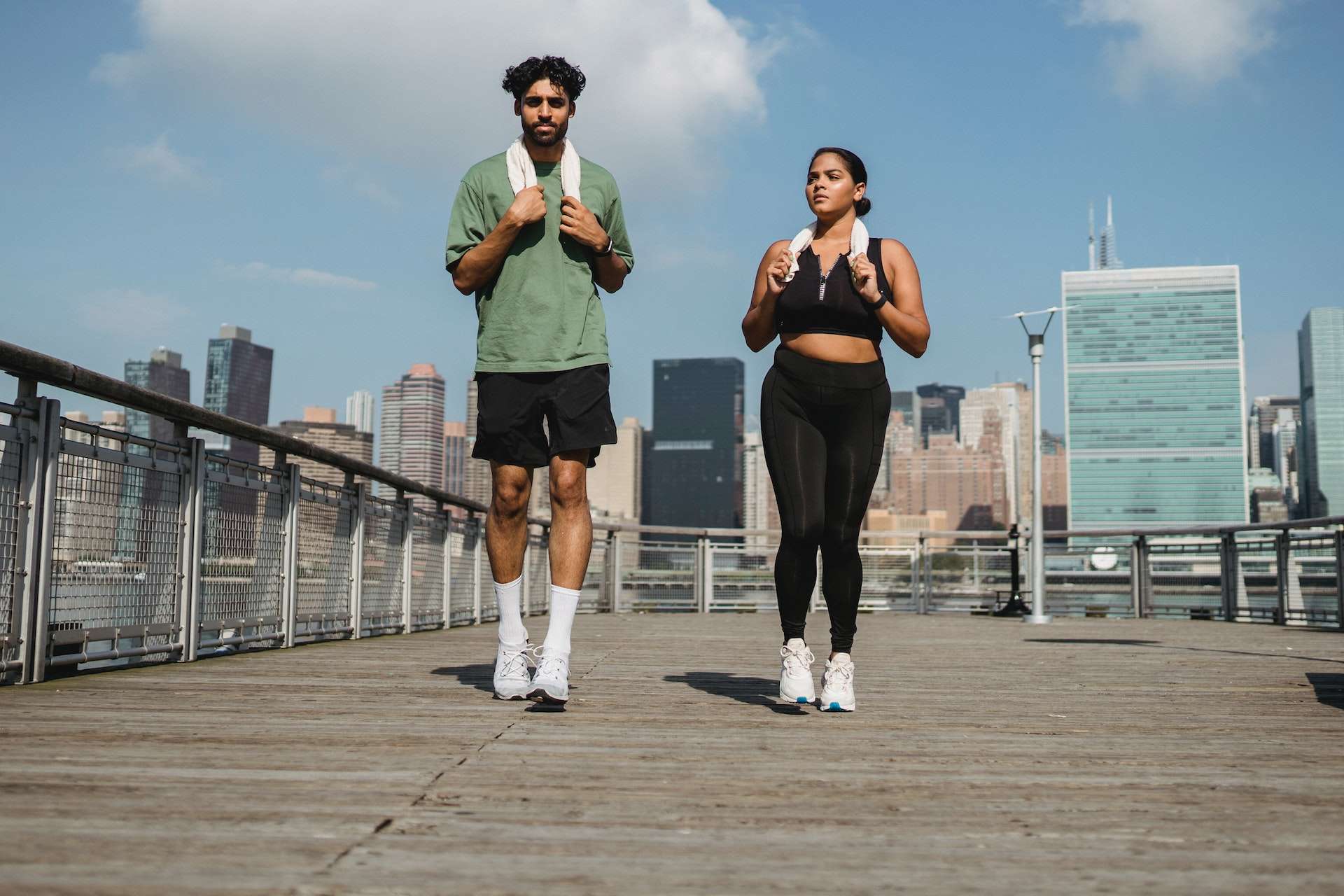Couple in Sportswear Jogging Outdoors 