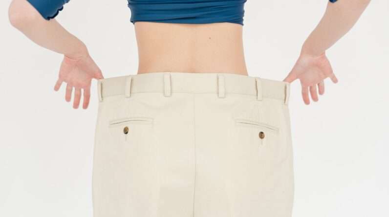Crop slender woman in oversized pants