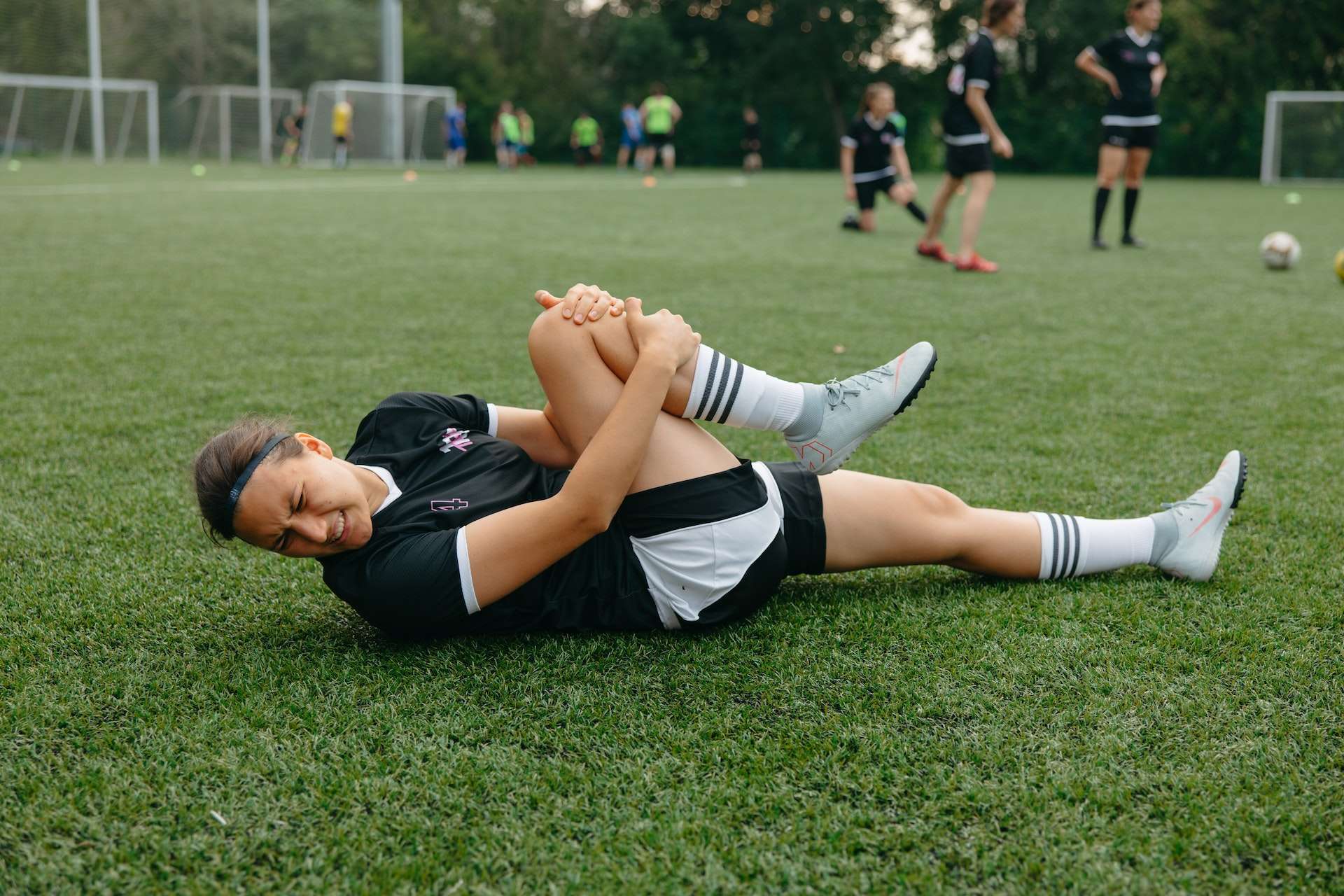 Injured Athlete Lying on a Soccer Field 