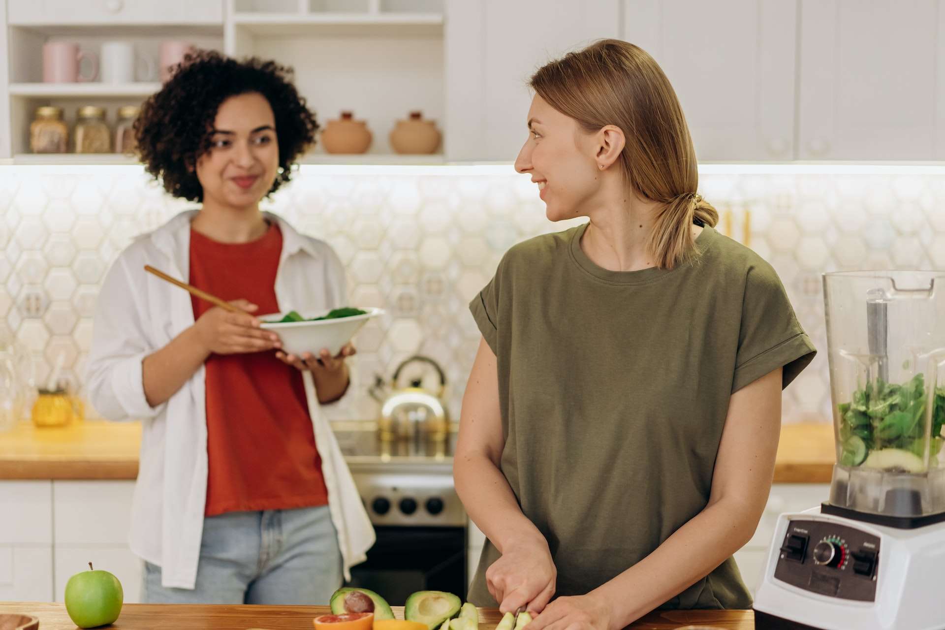 Two Women Preparing A Healthy Dish