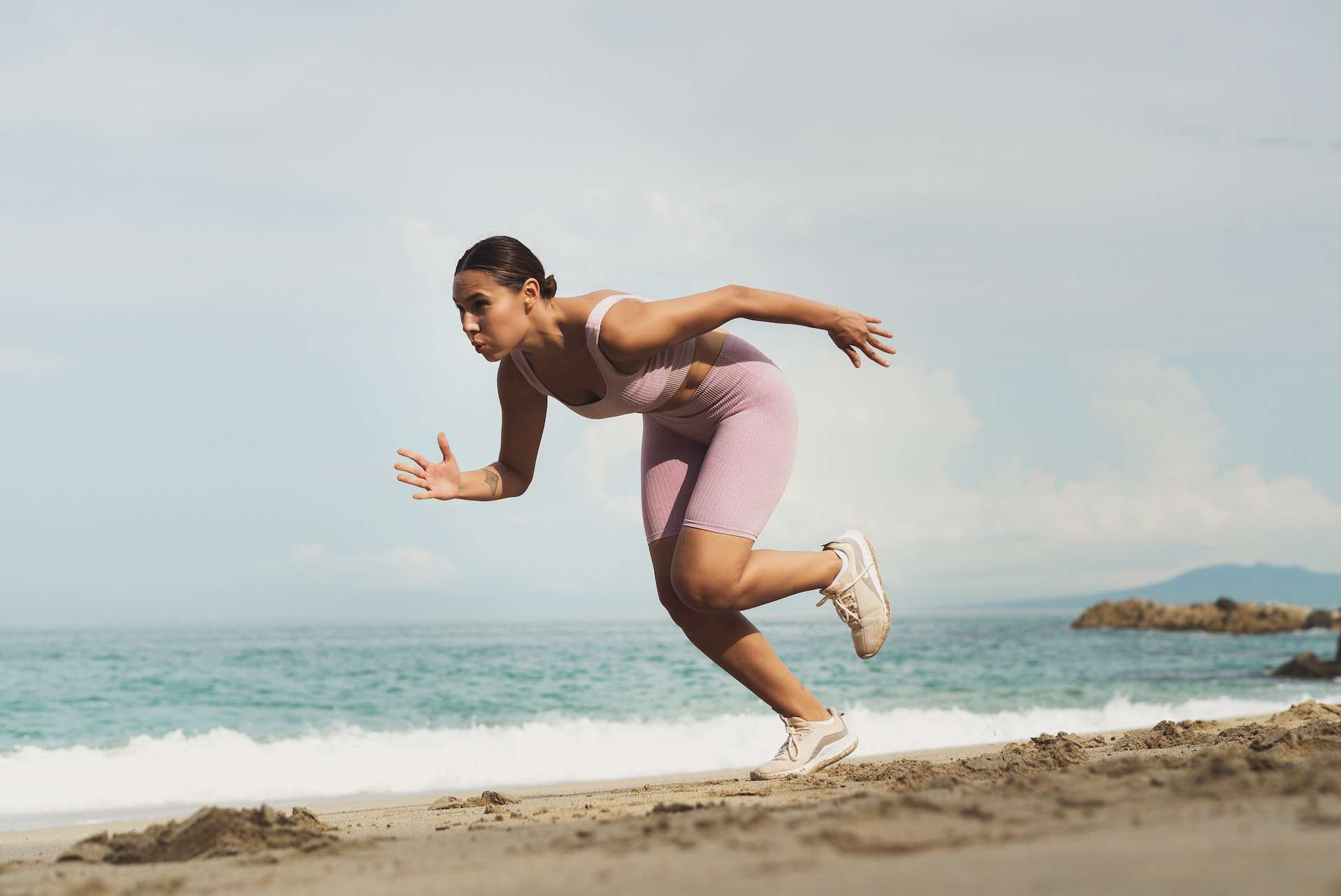 Woman Running on Beach 