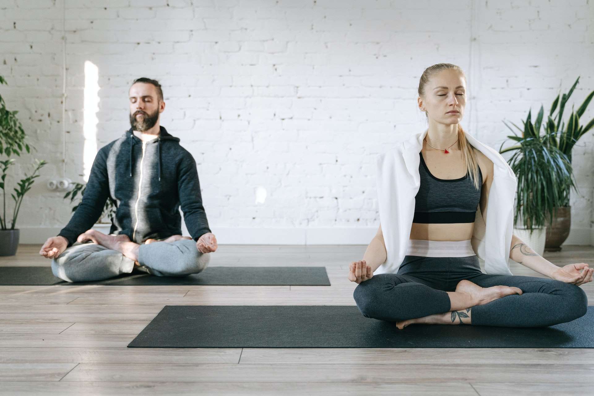 a couple practicing breath yoga