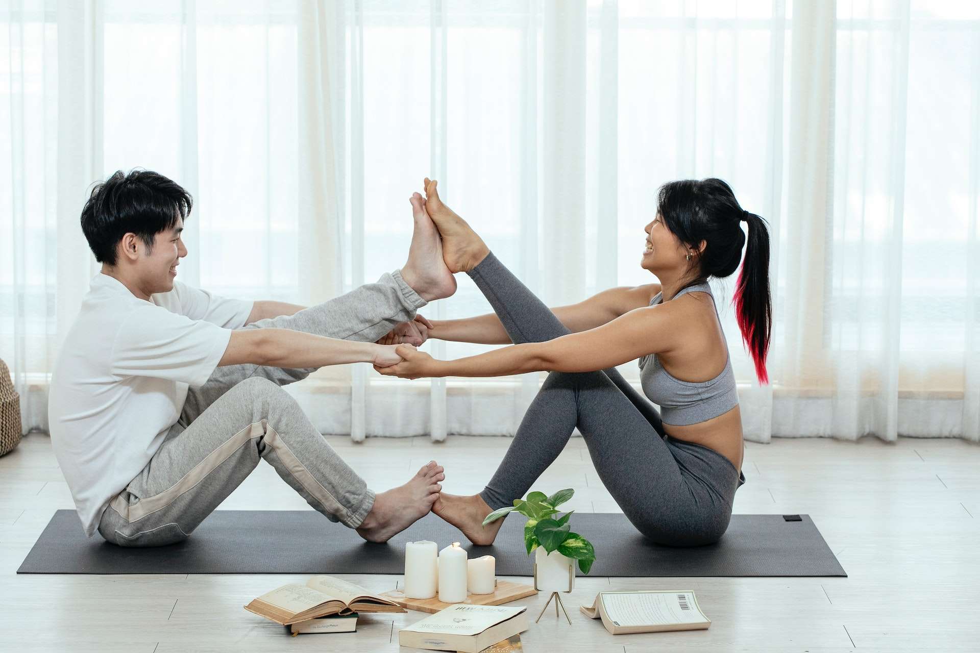 couple doing acro yoga