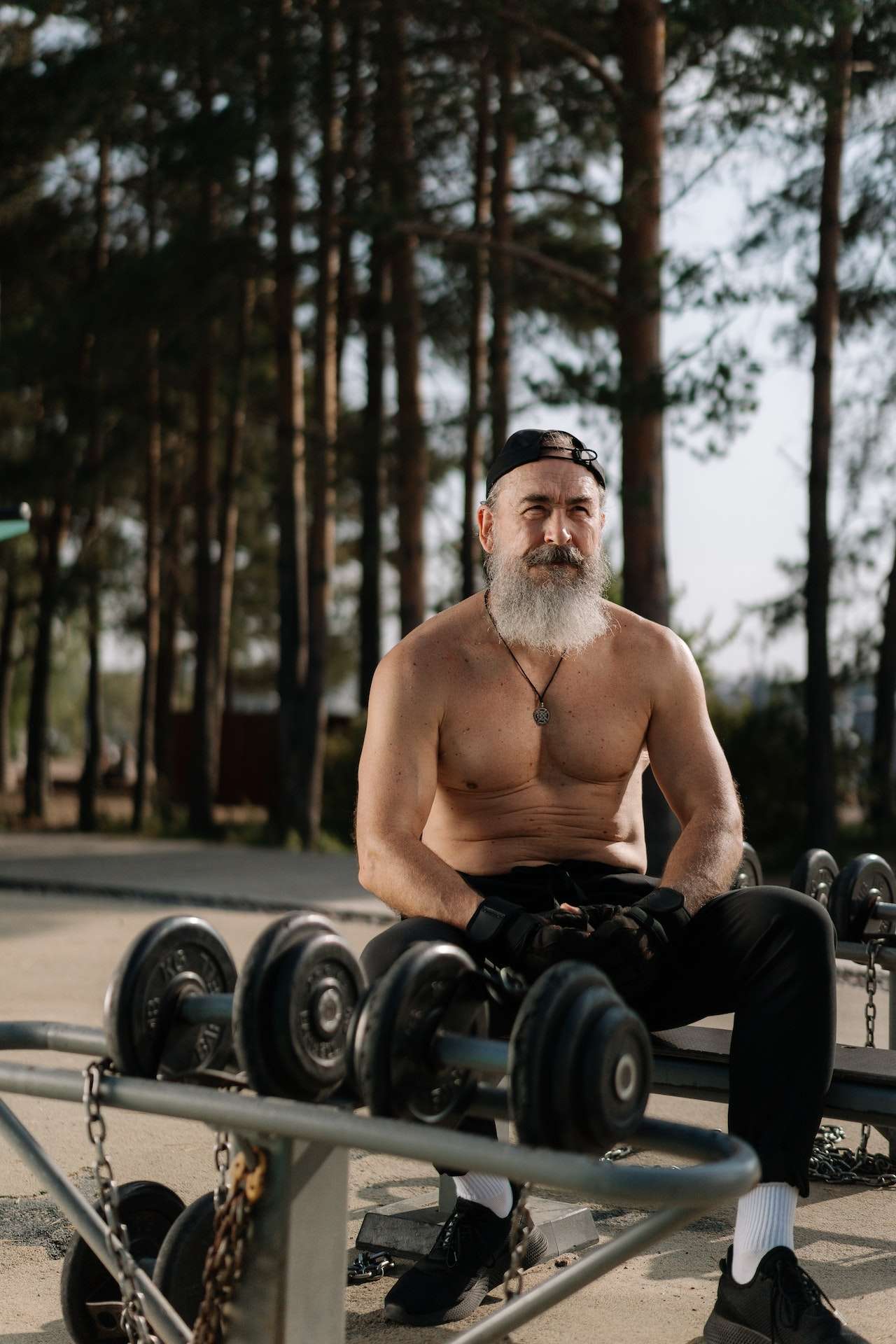 A Shirtless Man at an Outdoor Gym 