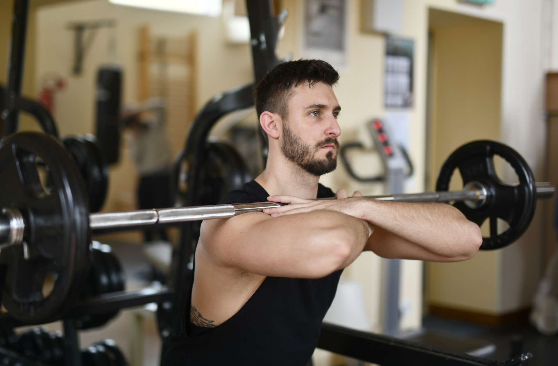 Man In Black Tank Top Working Out 