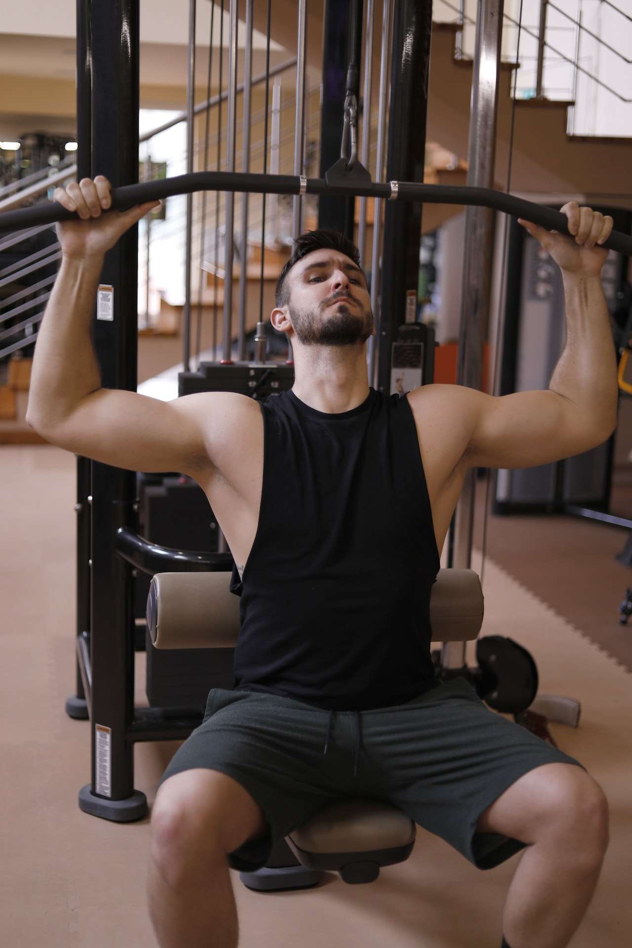 Man In Black Tank Top Working Out 