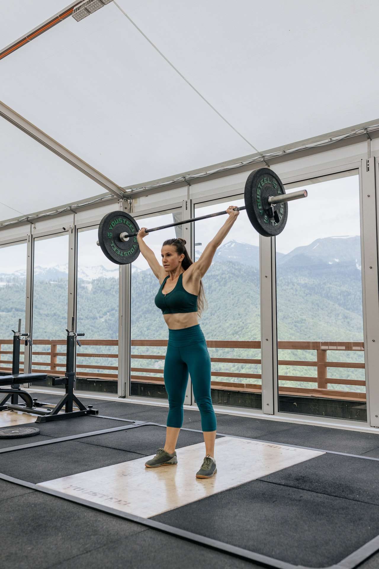 Strong Woman Lifting a Barbell 