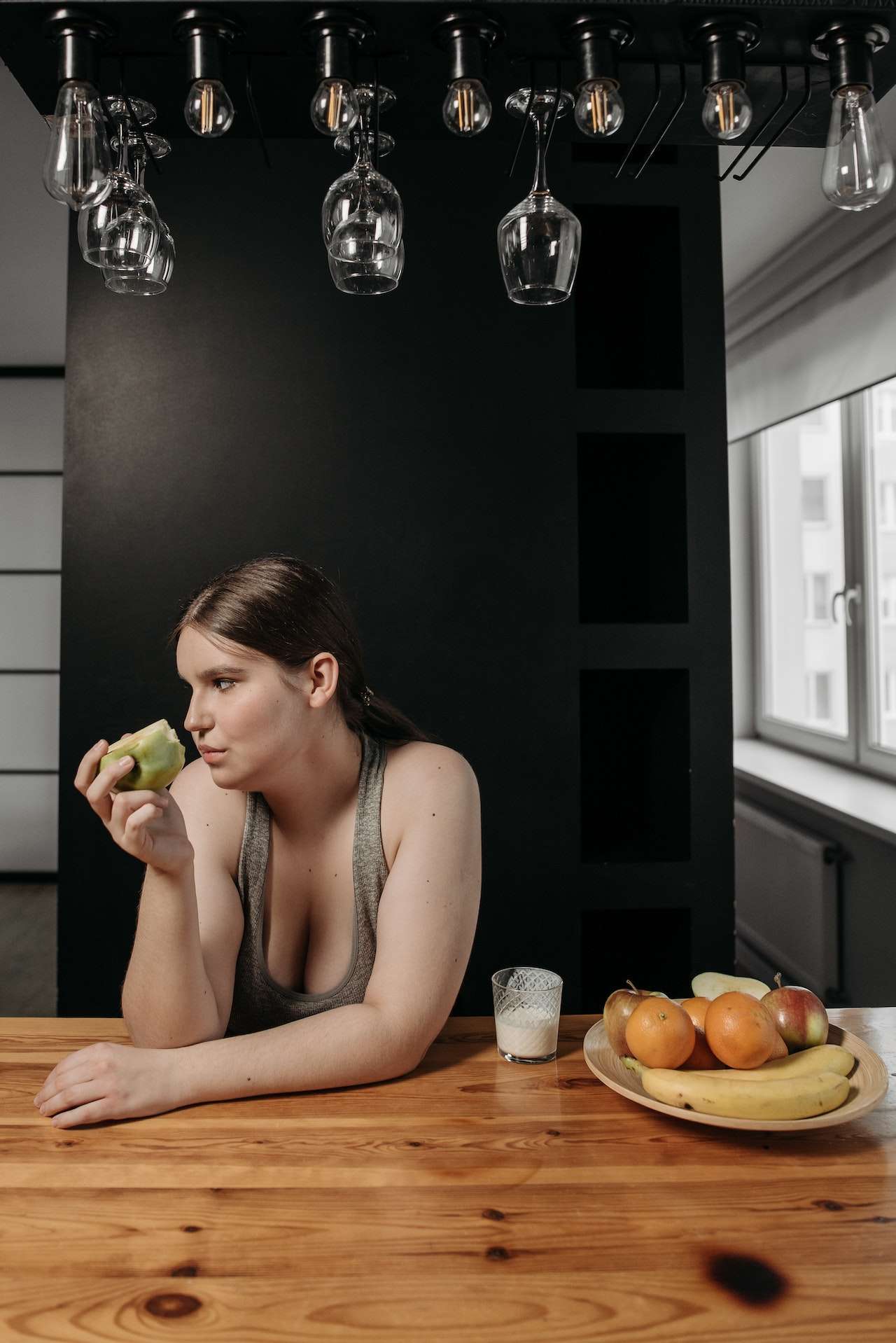 Woman Eating a Green Apple Fruit
